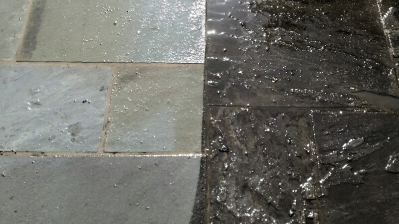 Flagstone patio half cleaned, before and after, in Millersville, MD